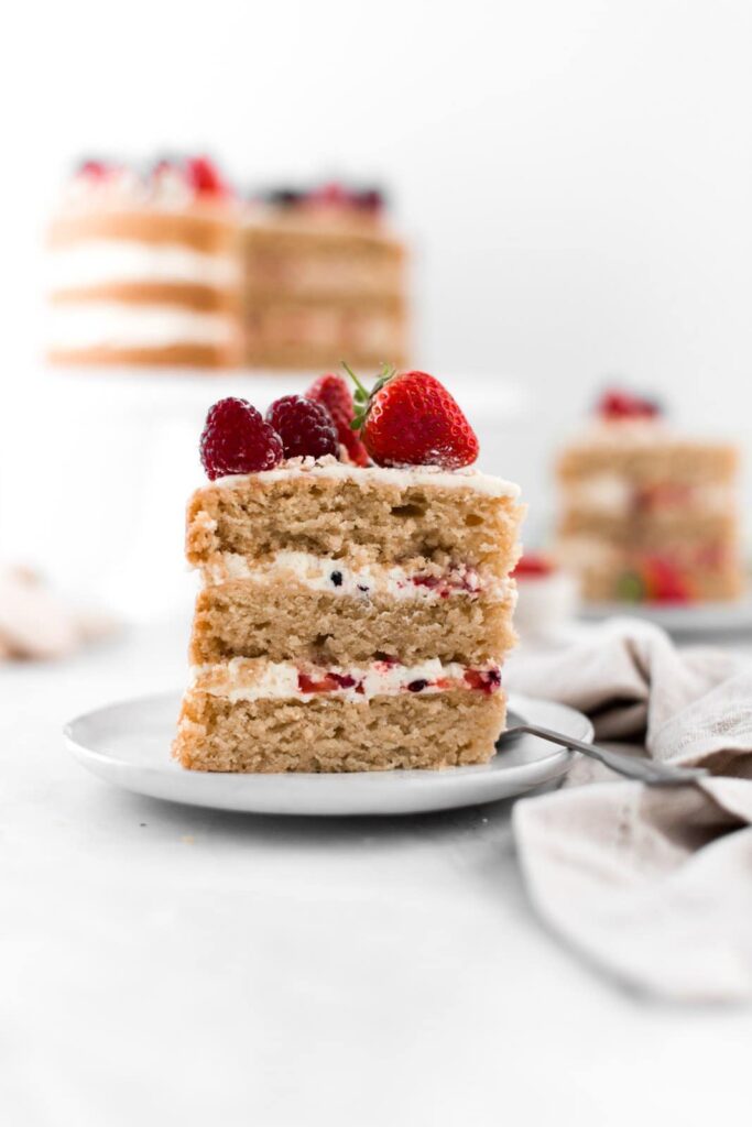 A slice of Eton Mess cake on a small plate.