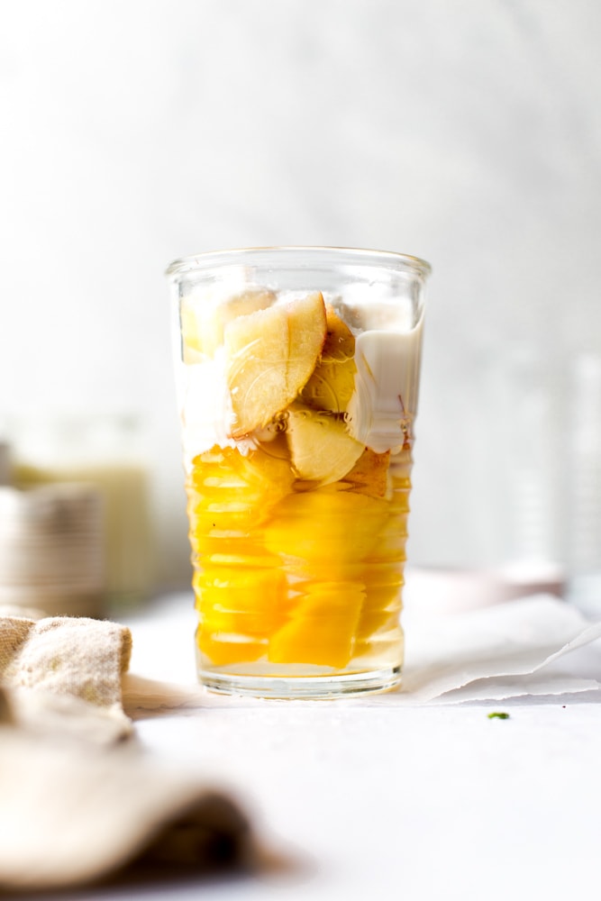 All the ingredients needed to make coconut water smoothie in a glass. 