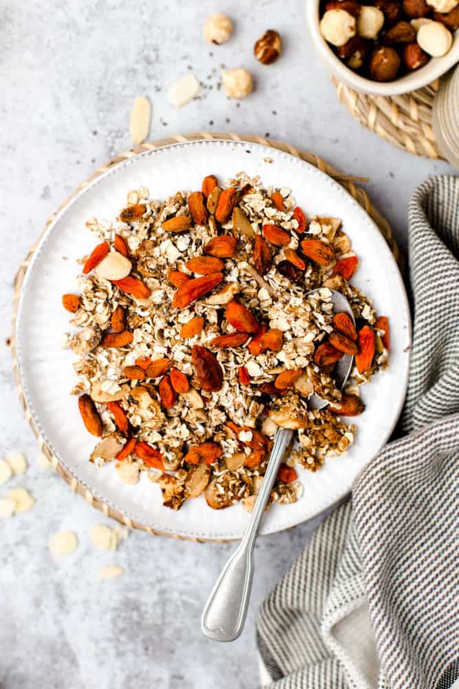 Vegan granola with goji berries on a small round plate. 