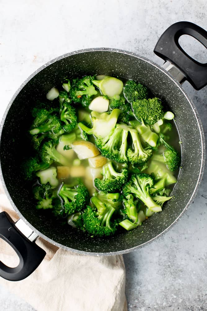 Green broccoli in a large marble pan.