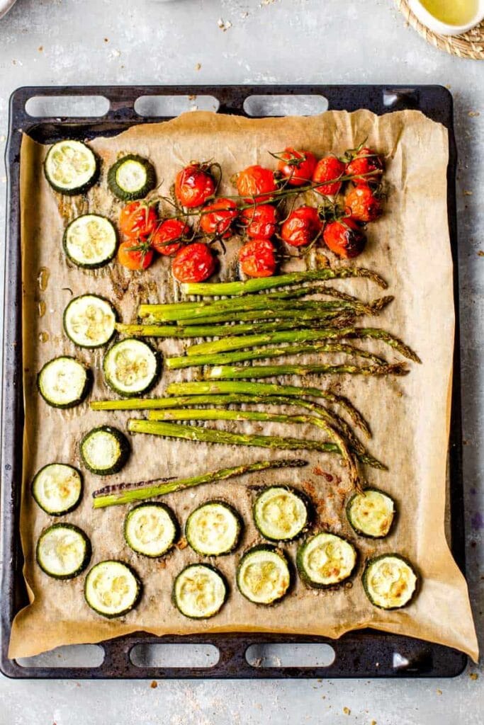 Roasted vegetables on a large baking tray.