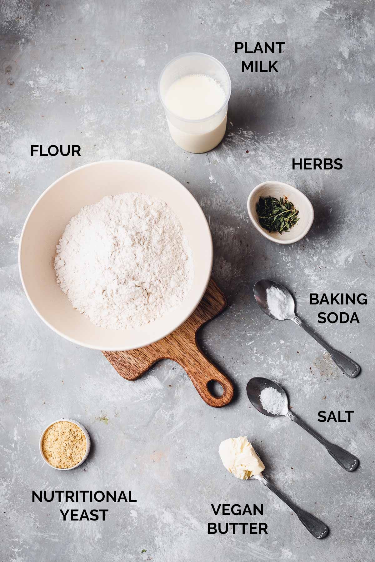 All the ingredient needed to make dumpling dough laid out on a flat surface. 