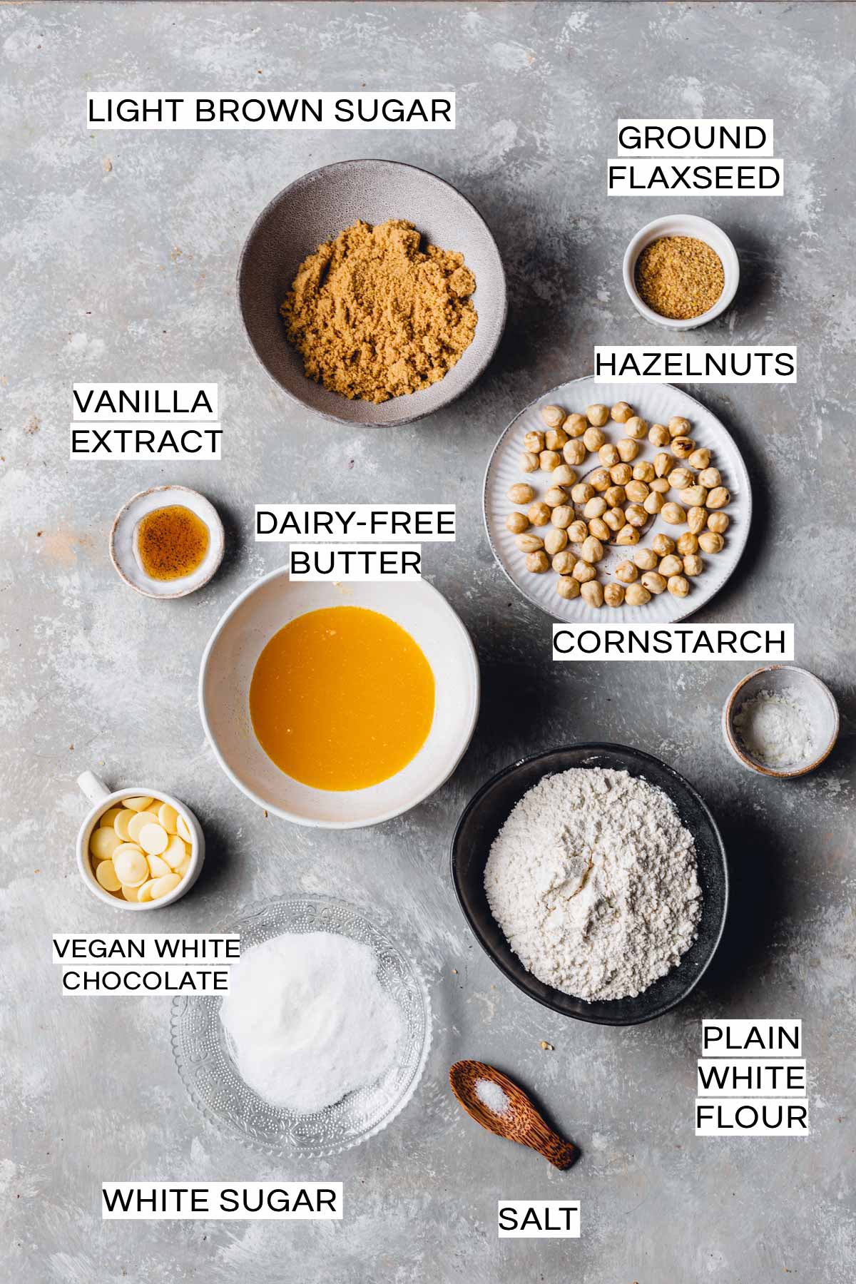 An overhead view of all ingredients needed to bake a blondie laid on a flat grey surface