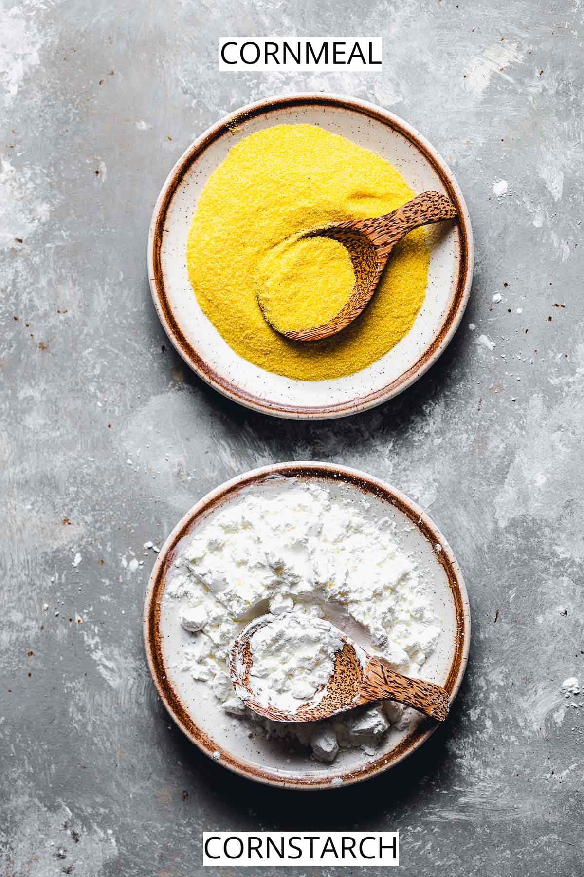 Two small plates filled with cornmeal and cornflour placed next to each other. 