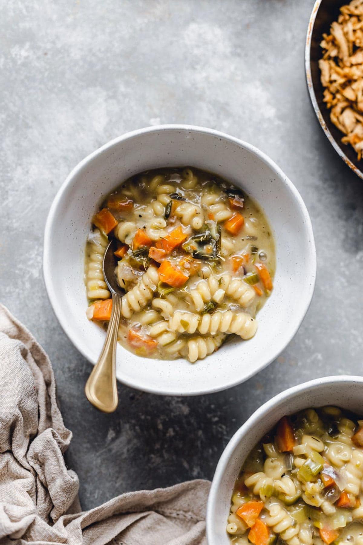 A bowl with vegan cream of chicken soup inside. 