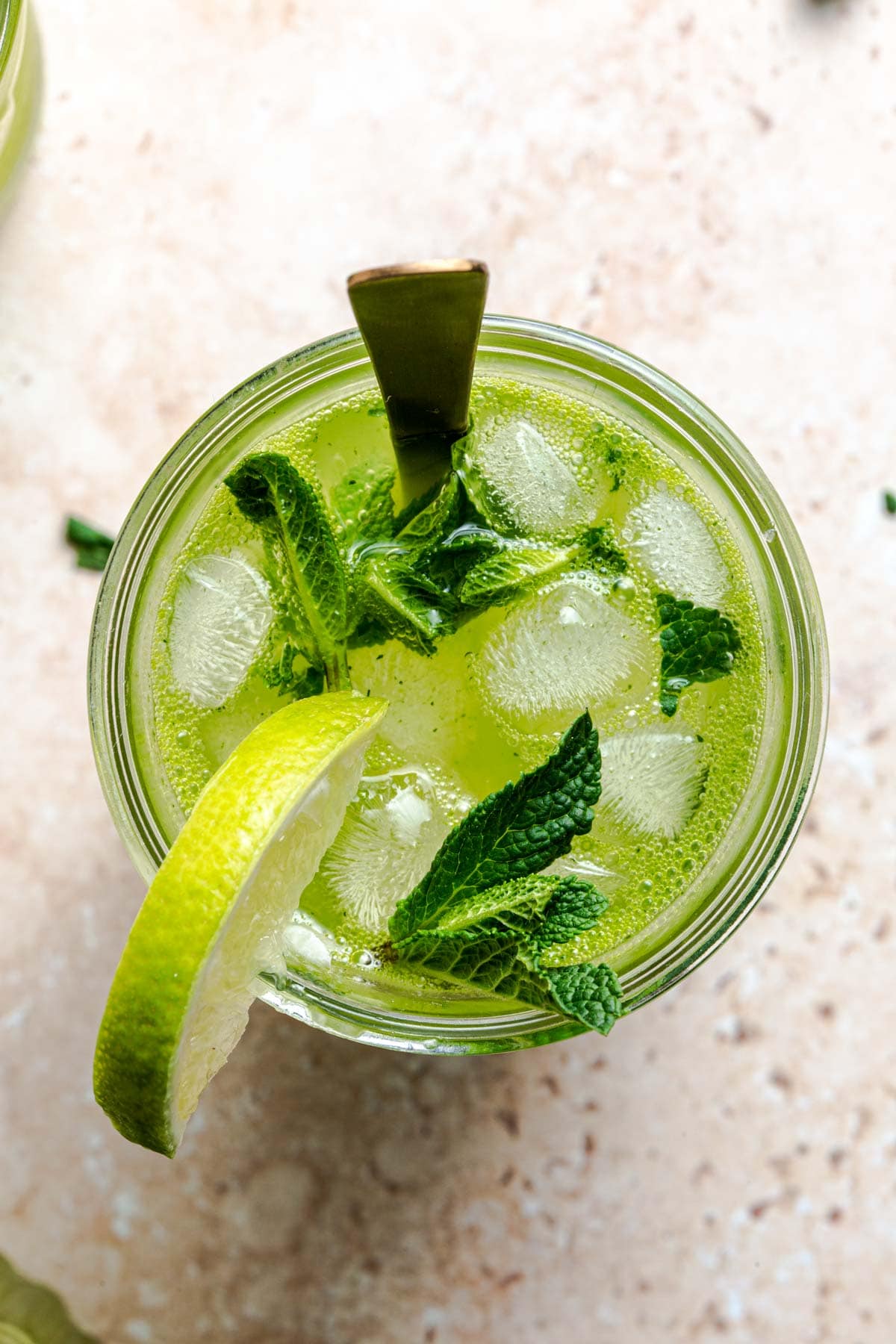 A close-up overhead image showing mojito cocktail.