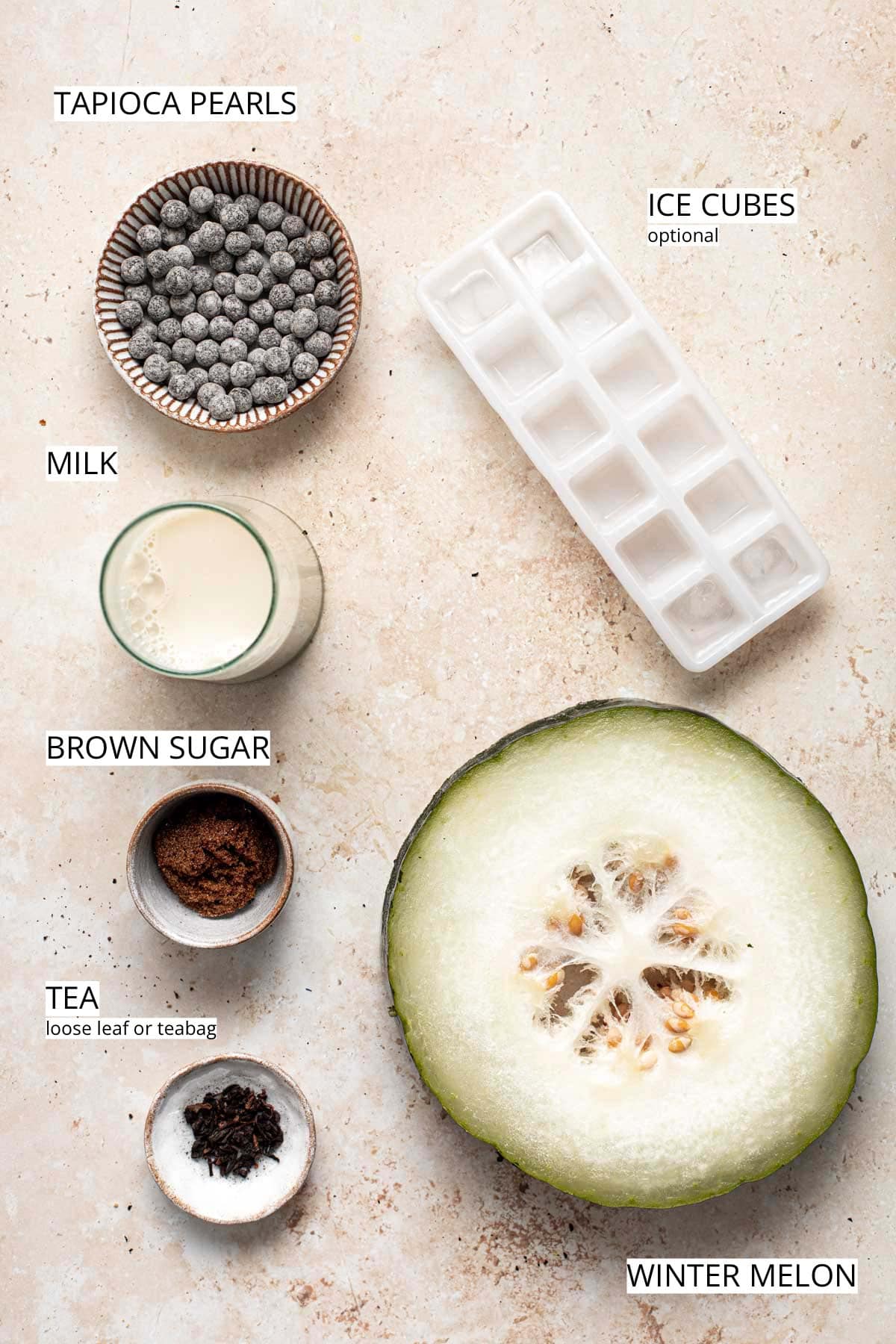 A flatlay of all the ingredients needed to make winter melon milk tea.