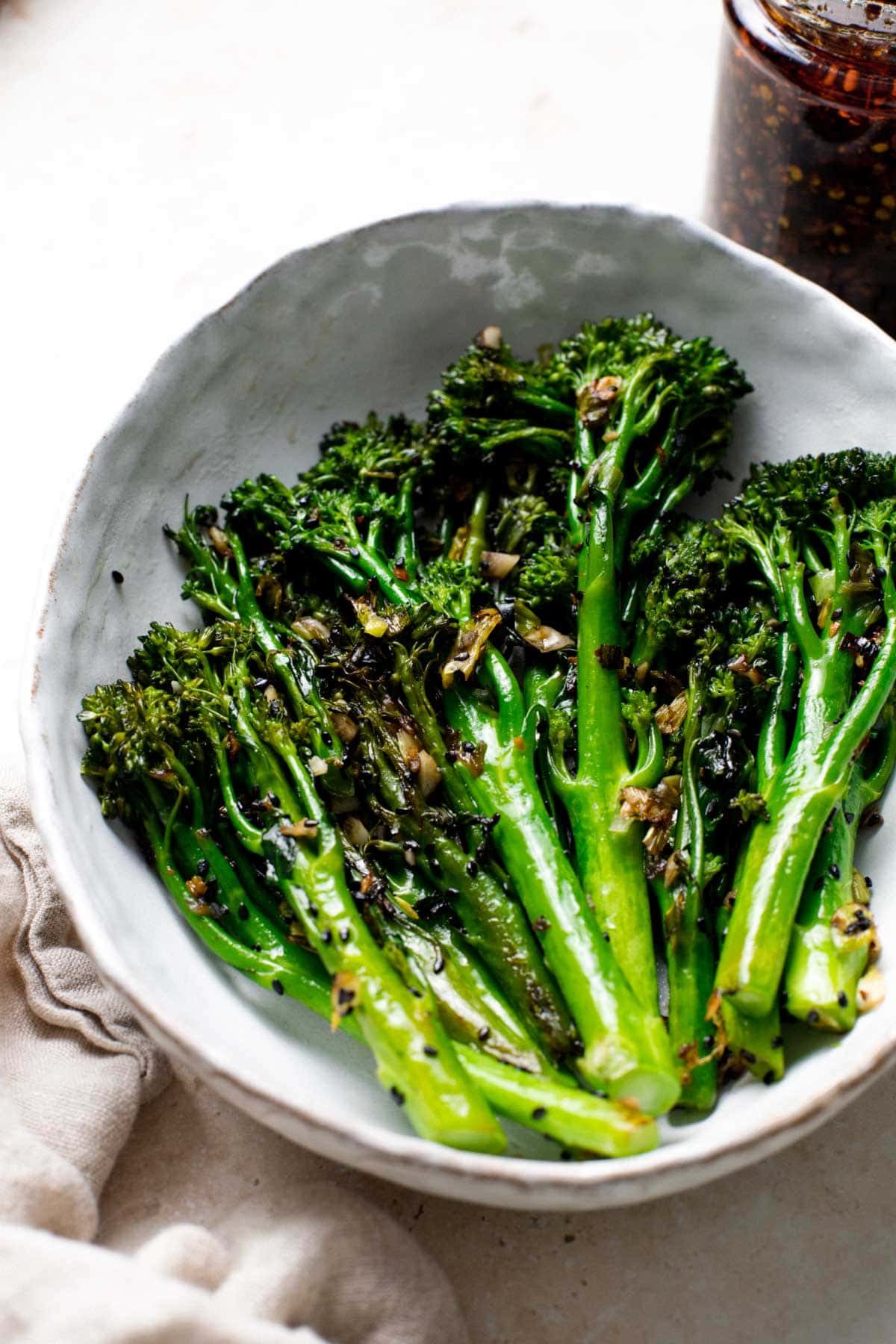 A large serving platter containing pan-roasted broccoletti.