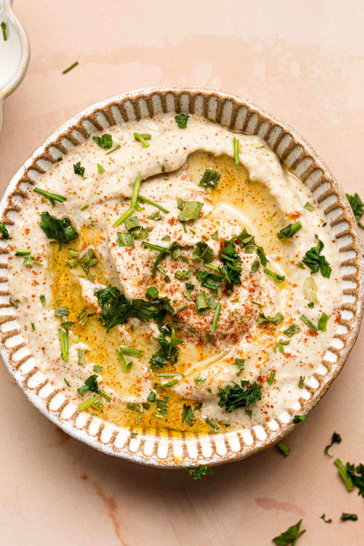 Baba ganoush topped off with parsley, olive oil and paprika.