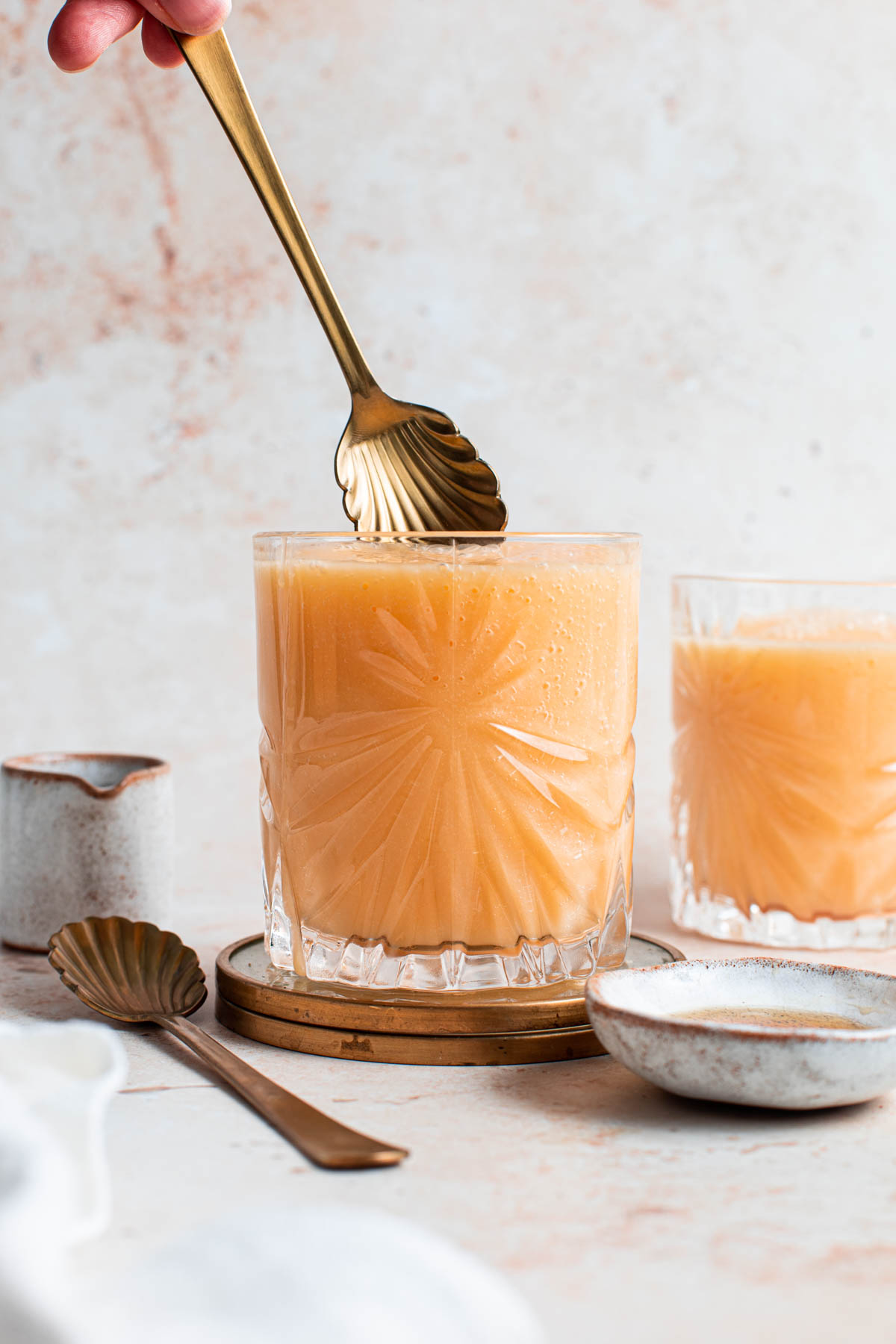 A glass filled with papaya milk.