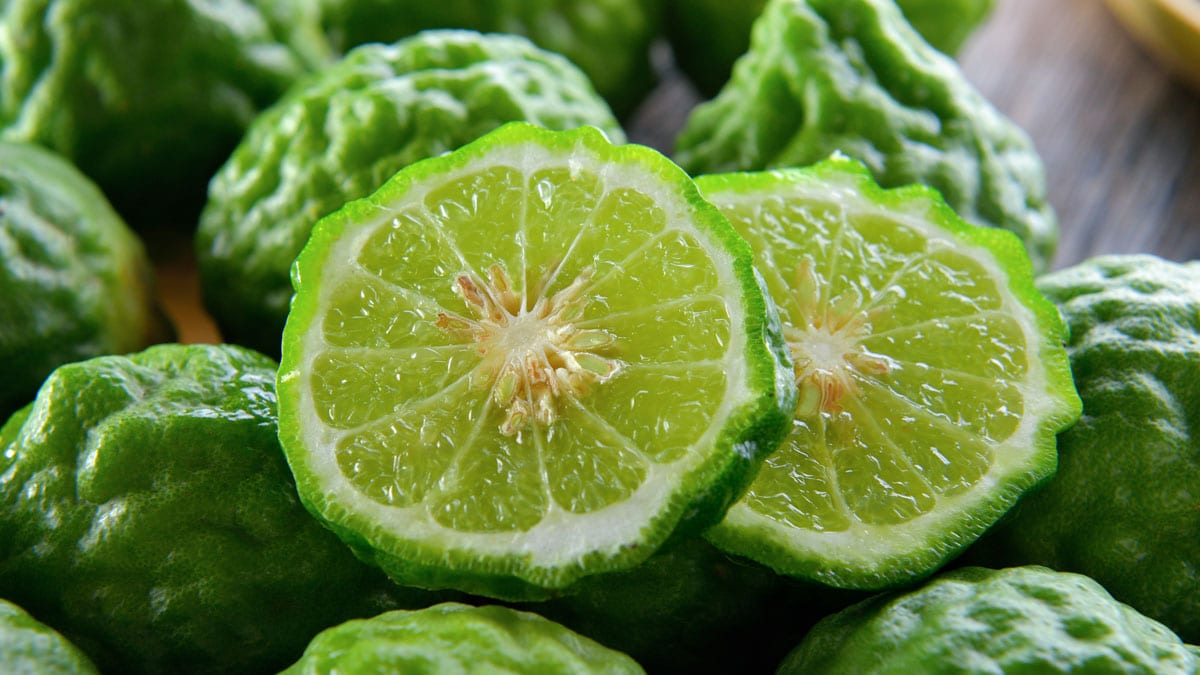 Bergamot on wooden table background.