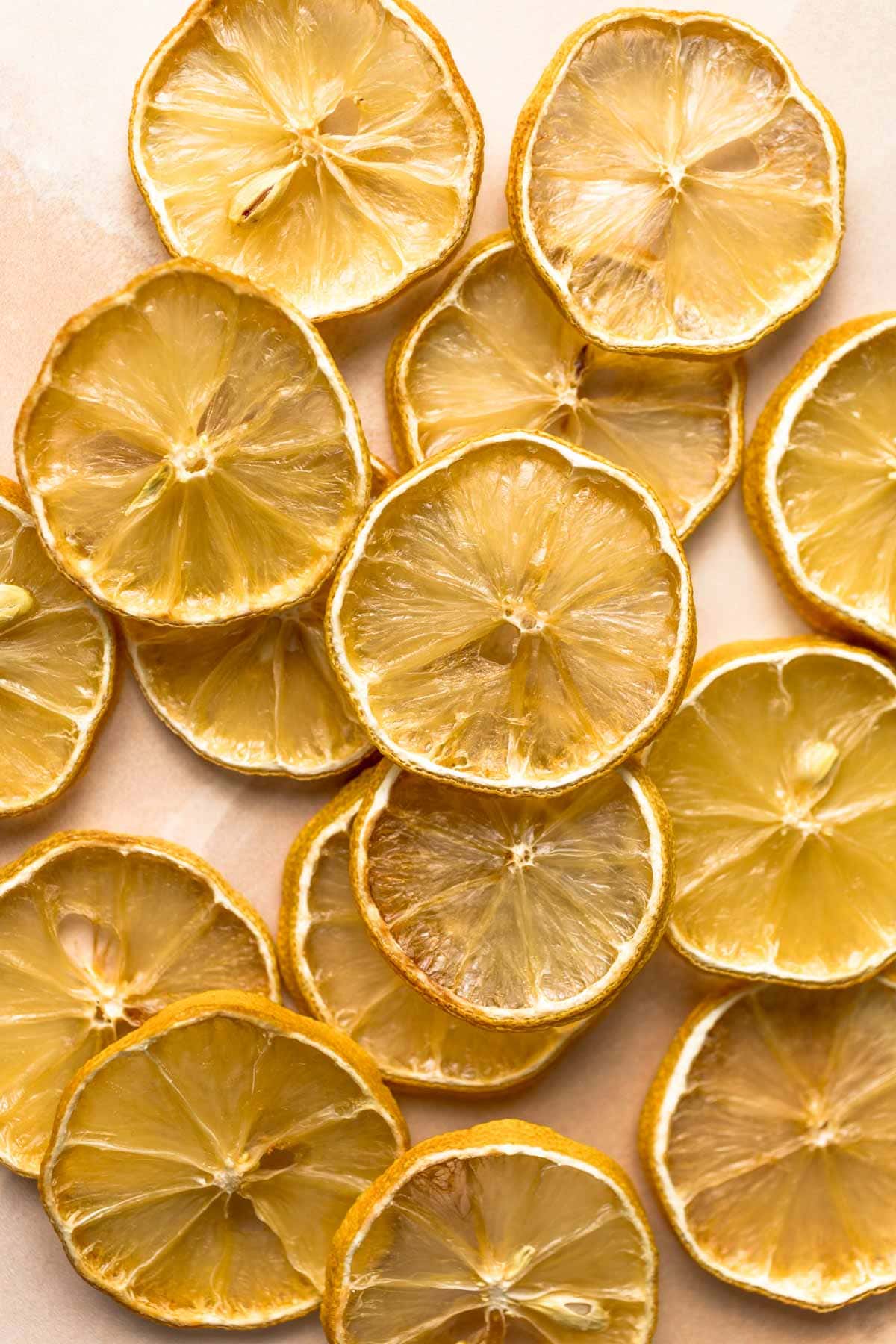 An overhead view of dried lemons on a flat surface. 