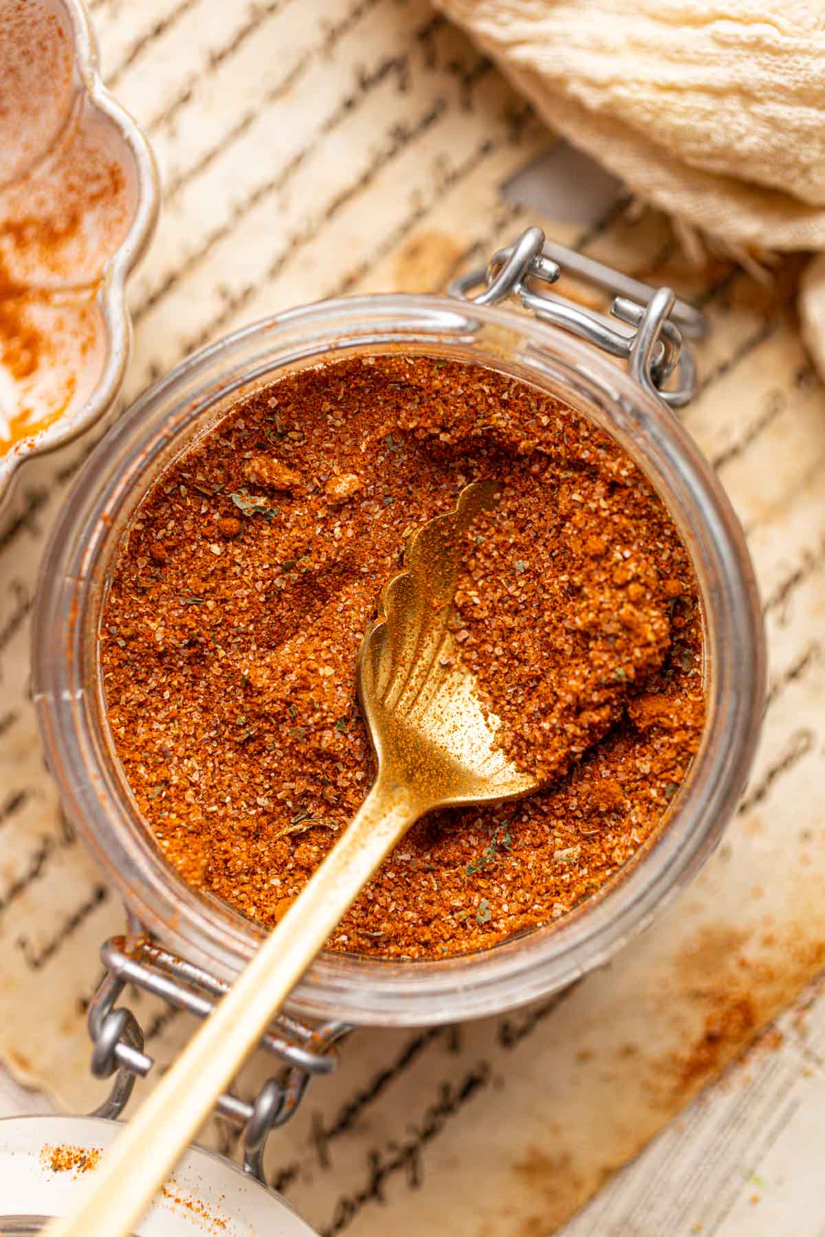 An overhead view of Red Robin seasoning in a glass jar.