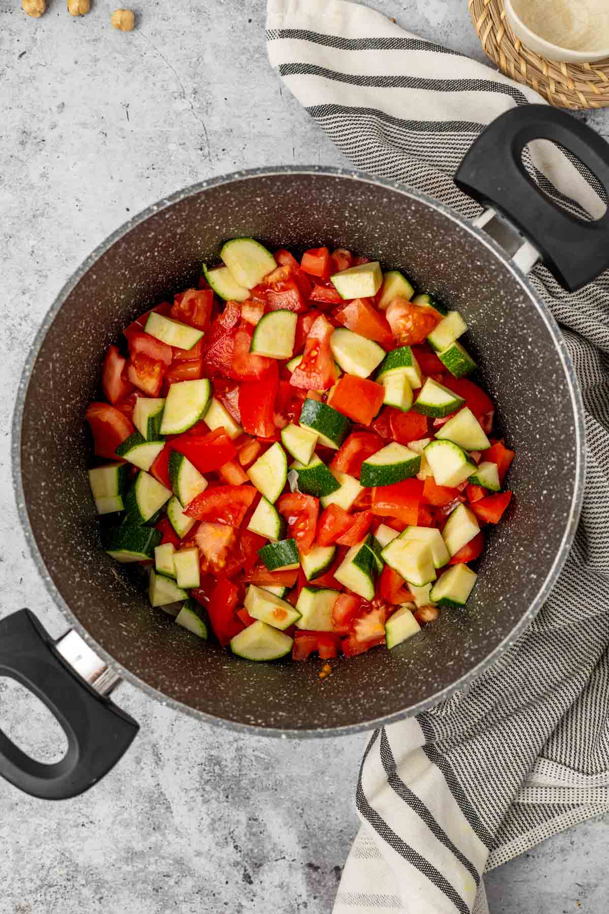Vegetable soup being made in a pan.