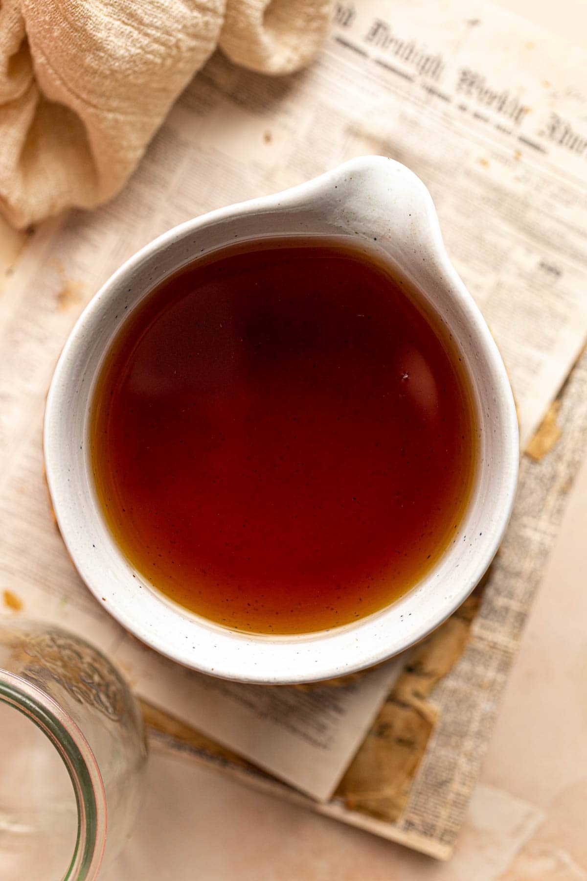 An overhead view of a bowl with Earl Grey syrup.