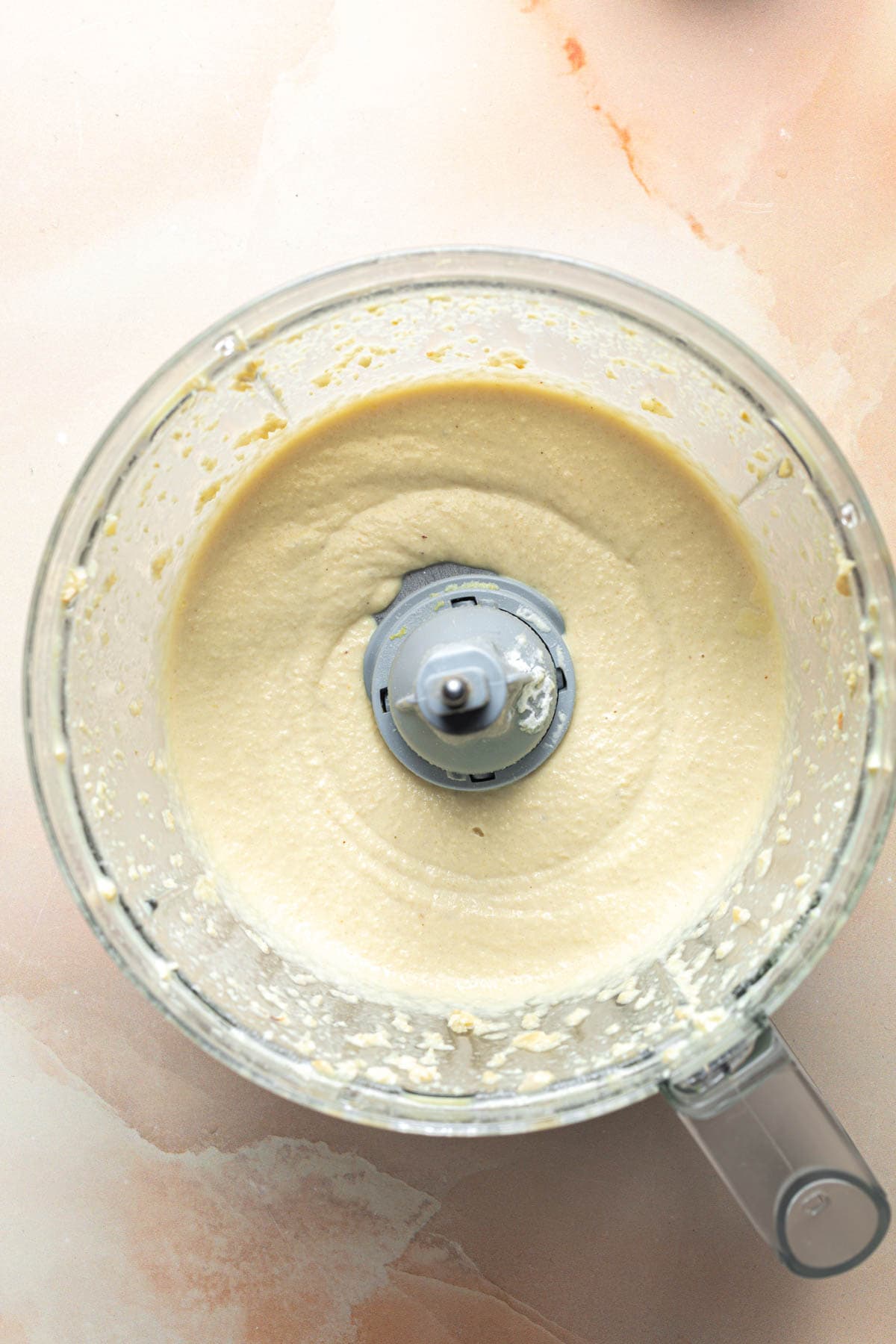 A vegan cheese mixture in a food processor.