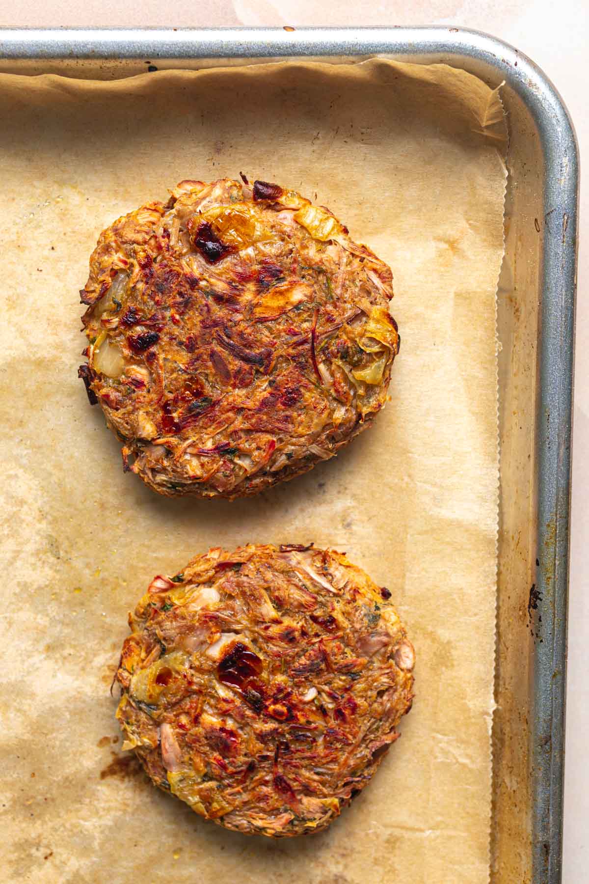 Oven baked jackfruit burgers on a tray