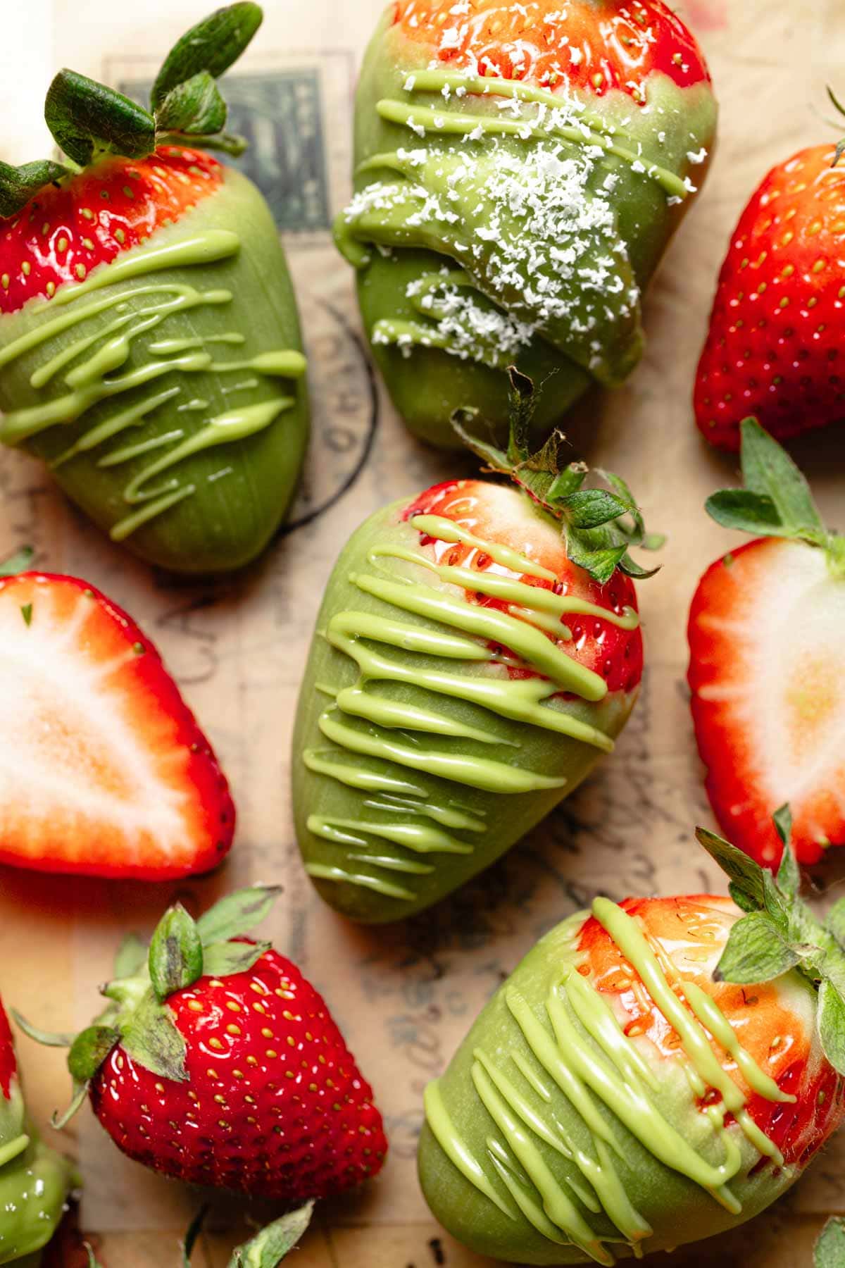 Matcha strawberries on a brown surface