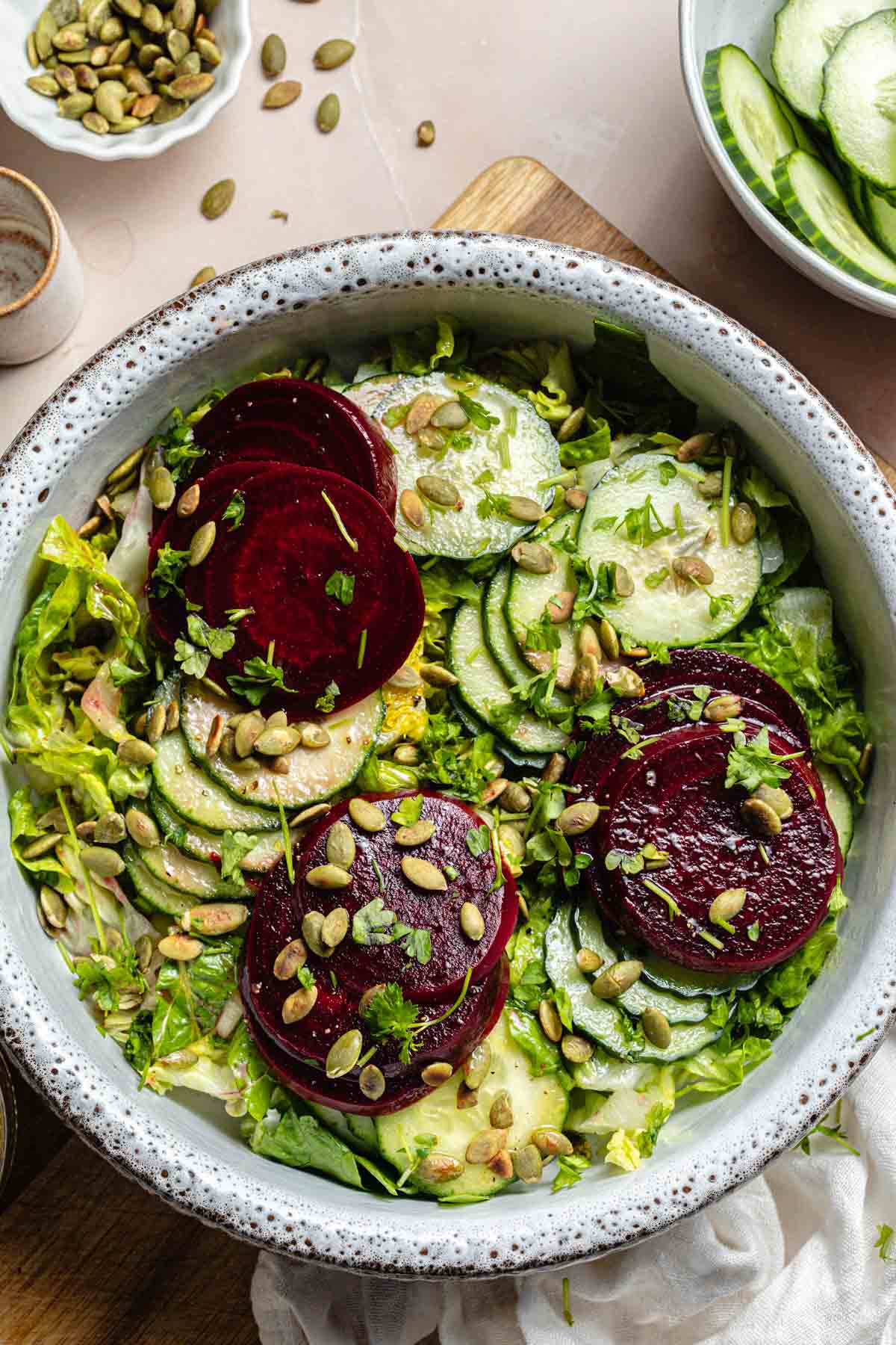 A large bowl filled with cucumber beet salad.