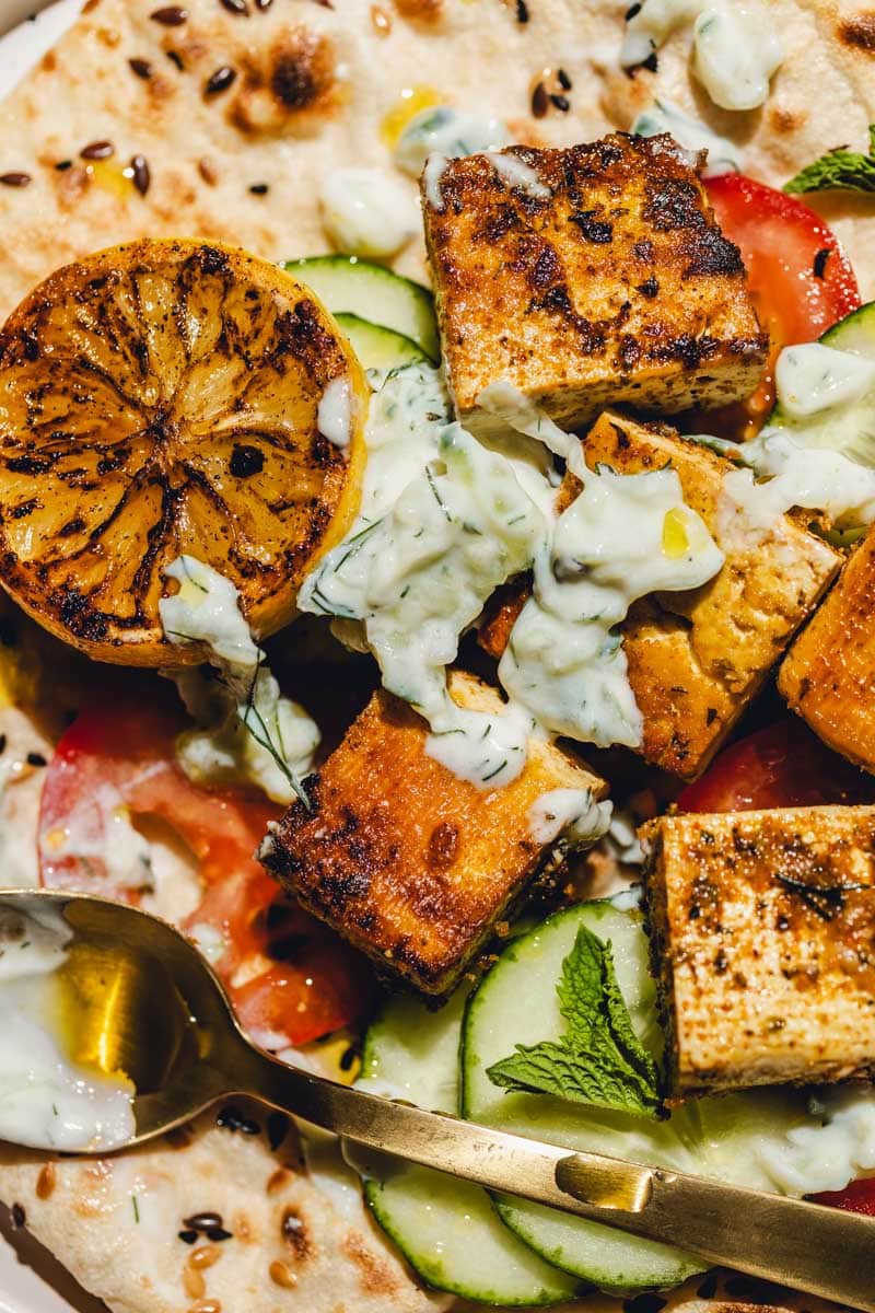 A close-up of vegan souvlaki with pita and toppings