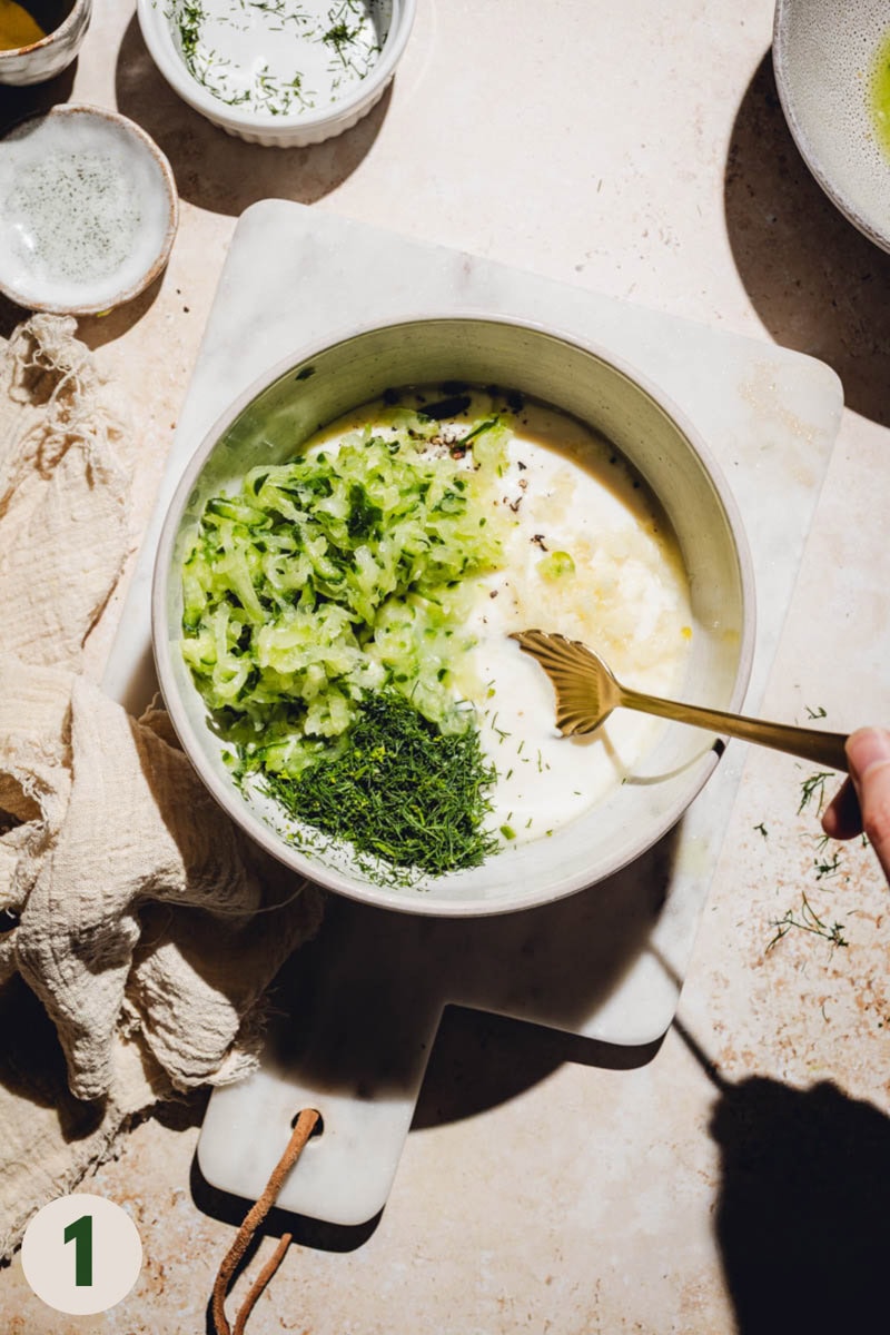 All tzatziki ingredients in a large bowl