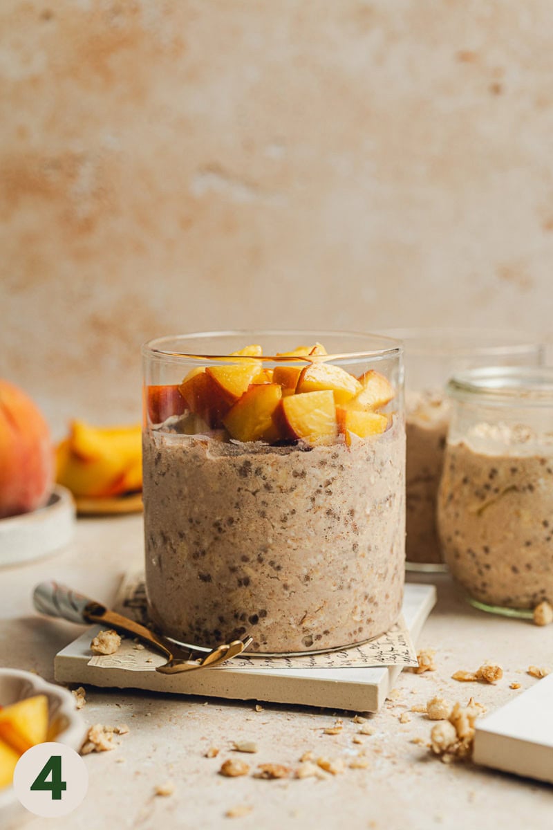 Overnight oats in a glass with chopped peach