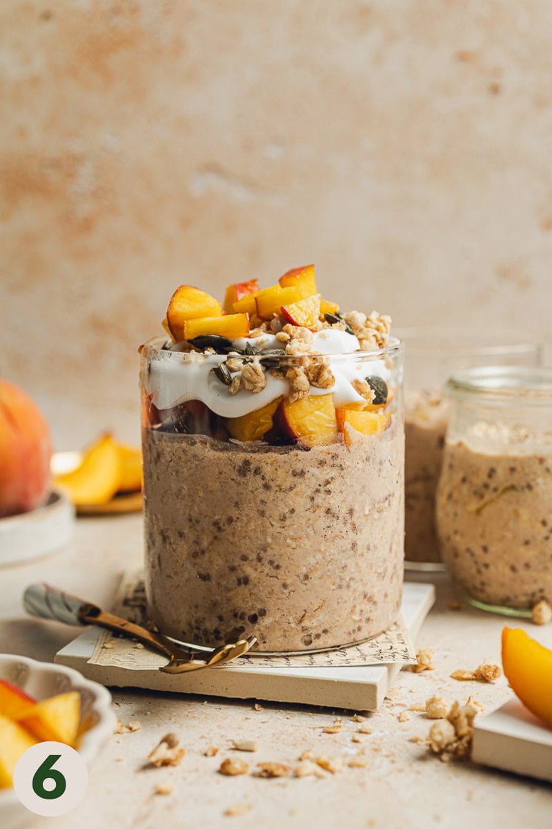 A jar of peach cobbler overnight oats