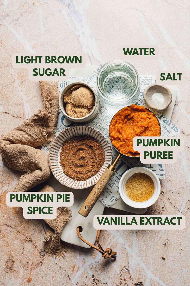 Various ingredients needed for pumpkin sauce placed on a marble board