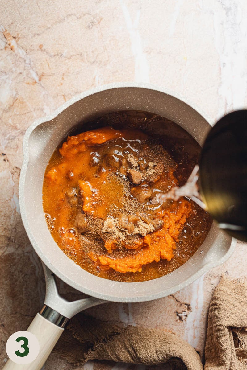 Water being added to saucepan