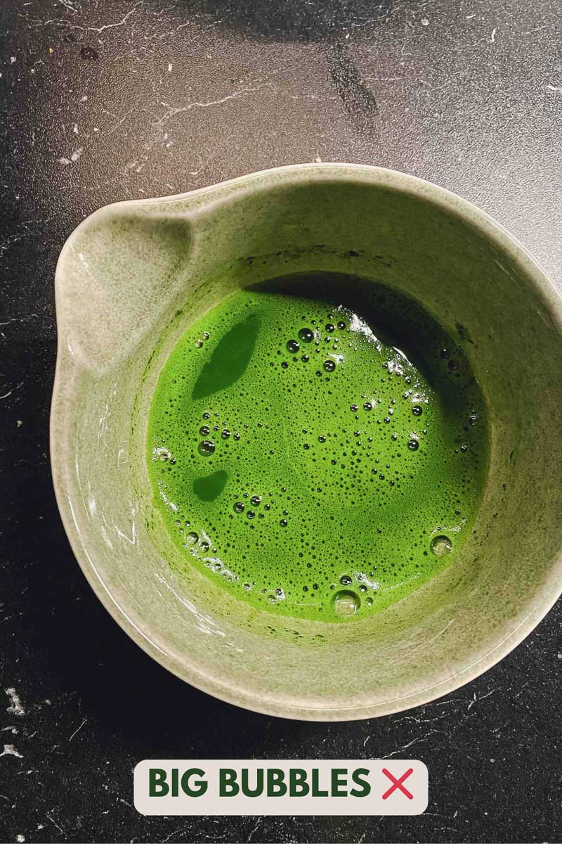 Poorly whisked matcha with big bubbles in a bowl