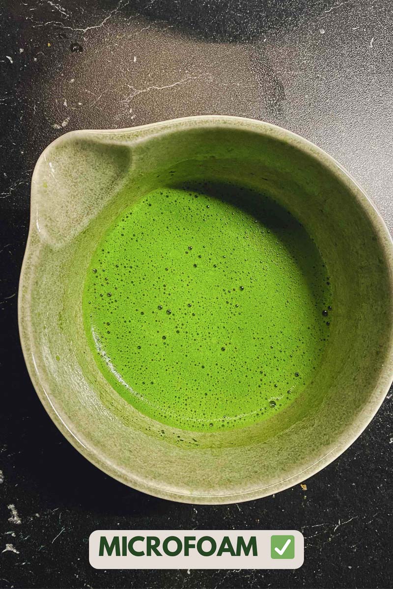 Well-whisked matcha with a thin layer of foam in a bowl