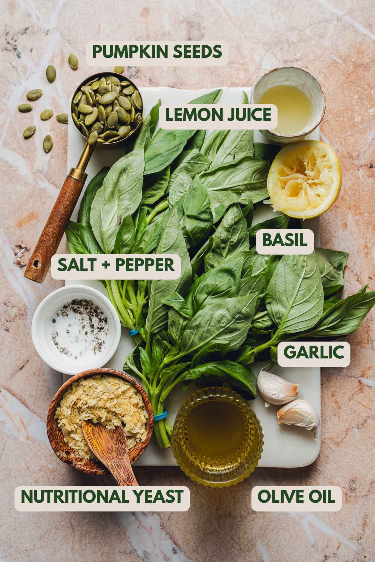 Various ingredients like basil on a white board