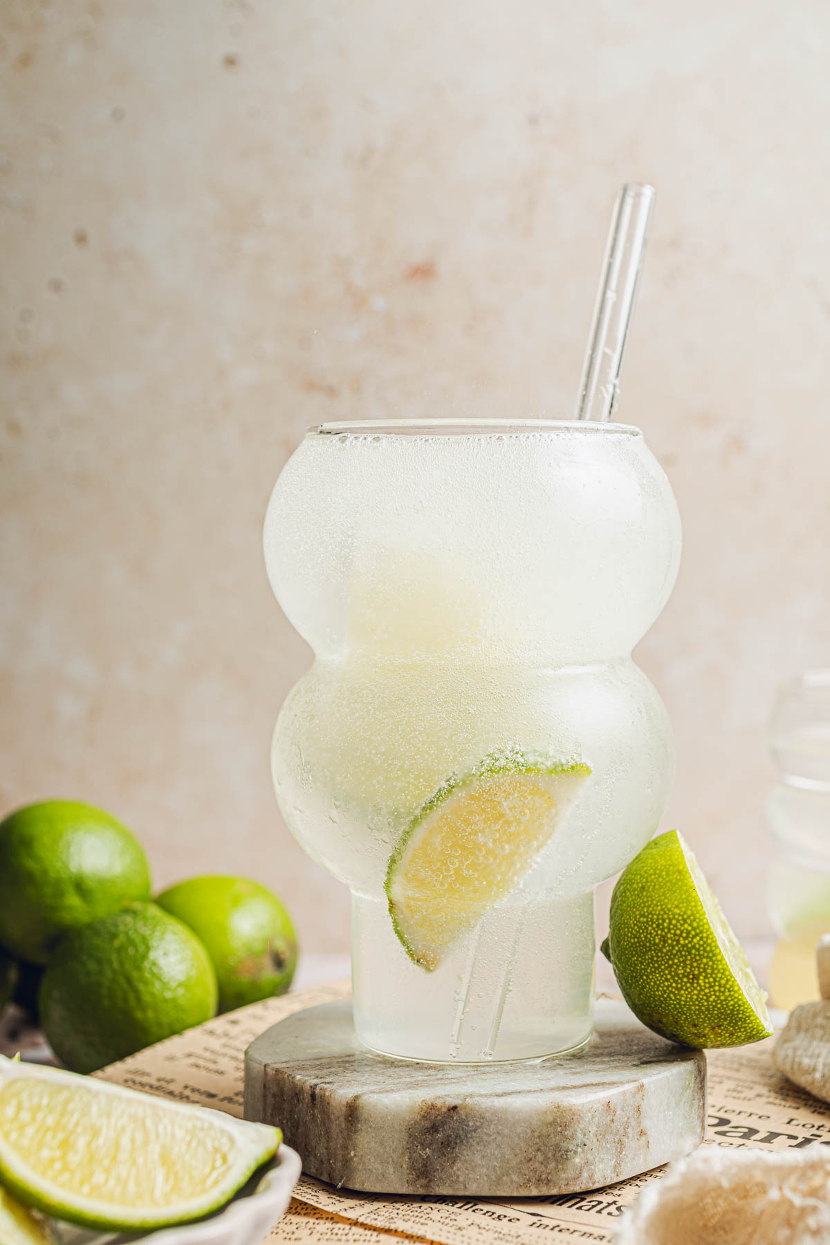 Fizzy limeade drink in a round glass